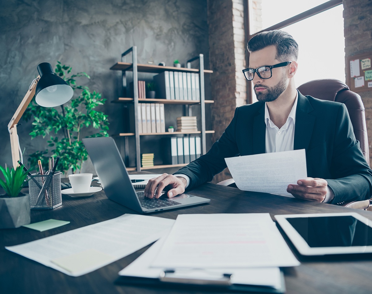 male human resources manager working on computer in office