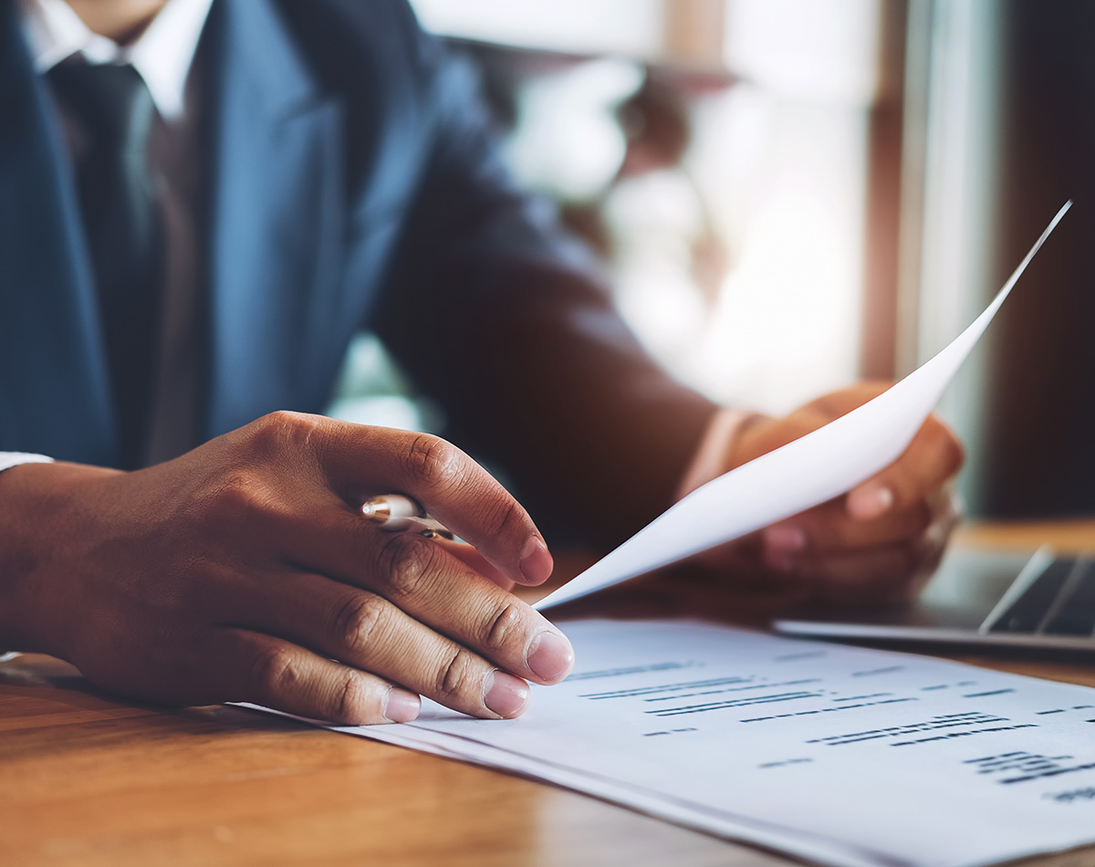 HR manager reviewing applications at desk